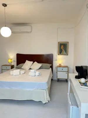 Letto o letti in una camera di Domo Nea