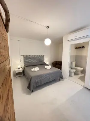 Letto o letti in una camera di Domo Nea