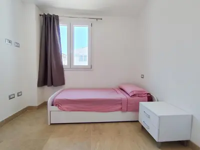 Letto o letti in una camera di Villetta Borgo Bianco 1 with shared pool