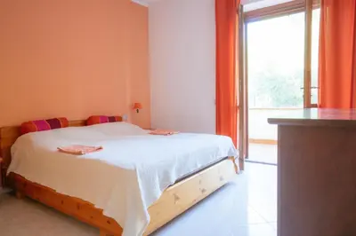 Letto o letti in una camera di Casa Roberta