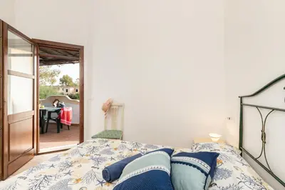 Letto o letti in una camera di Residenze Corallo - Cala Liberotto