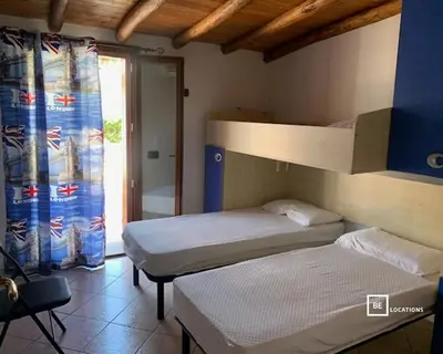 Letto o letti in una camera di BeLocations - Villa a San Teodoro con piscina privata
