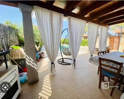 Area soggiorno di BeLocations - Villa a San Teodoro con piscina privata