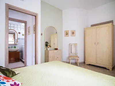 Letto o letti in una camera di Apartment Wohnung 'Casa Sale' mit Bergblick by Interhome