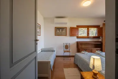 Letto o letti in una camera di Villa La Torretta - Waterfront & Direct Beach Access