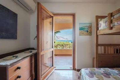 Letto o letti in una camera di Villa La Torretta - Waterfront & Direct Beach Access