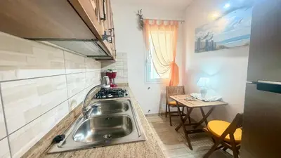 Cucina o angolo cottura di Budoni Casa Vacanze - ONDA MARINA