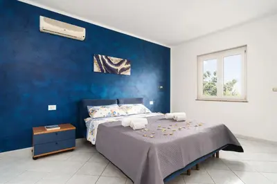 Letto o letti in una camera di Le Cale