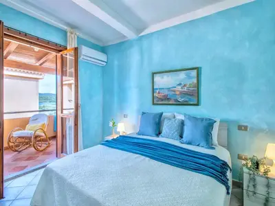Letto o letti in una camera di Apartment two bedrooms in Marinella just 150 mt from the sea