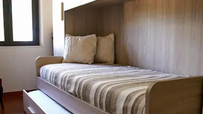 Letto o letti in una camera di Villa Marì Budoni