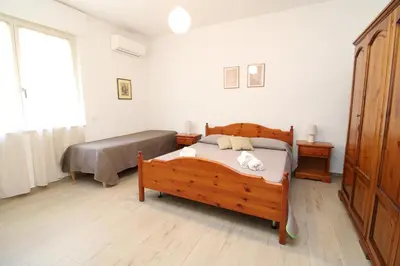 Letto o letti in una camera di Chiara House