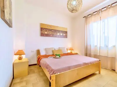 Letto o letti in una camera di Apartment 5 beds in Marinella just 300 mt from the sea