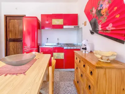 Cucina o angolo cottura di Apartment 5 beds in Marinella just 300 mt from the sea