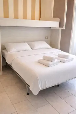 Letto o letti in una camera di Casa Perla