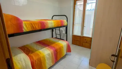 Letto o letti in una camera di Casa Duna 'E Mare con accesso diretto alla spiaggia