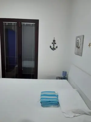 Letto o letti in una camera di YAYA appartamenti vacanza