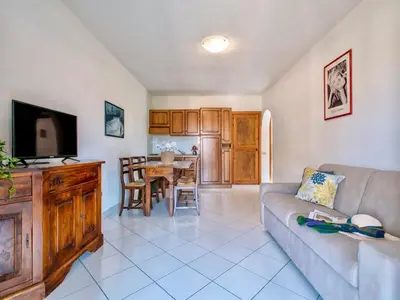 TV o dispositivi per l'intrattenimento presso Apartment 6 beds in Marinella with SEA VIEW