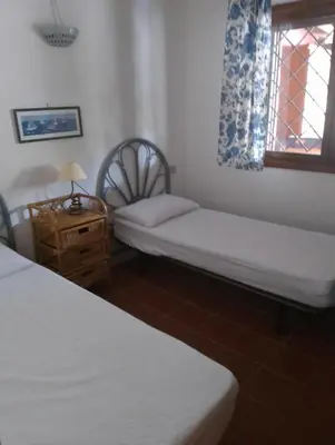 Letto o letti in una camera di Residence Costa Caddu San Teodoro