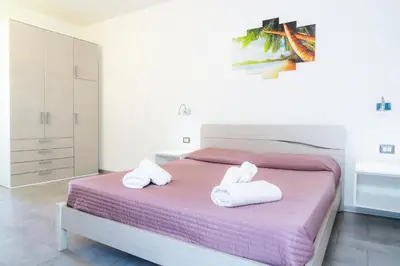 Letto o letti in una camera di Residence L'Ancora