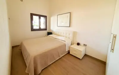 Letto o letti in una camera di Casabel - Appartamento con veranda panoramica a Orosei