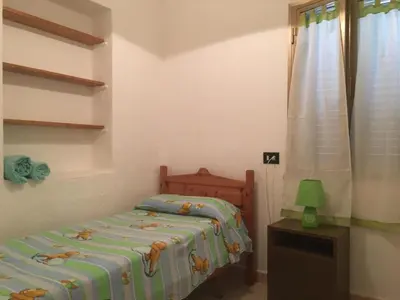 Letto o letti in una camera di Comodissima Casa al Mare 200 mt dalla spiaggia