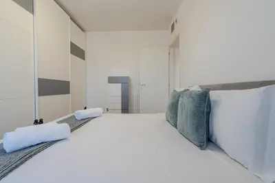 Letto o letti in una camera di OlbiAmare Appartamento di Lusso