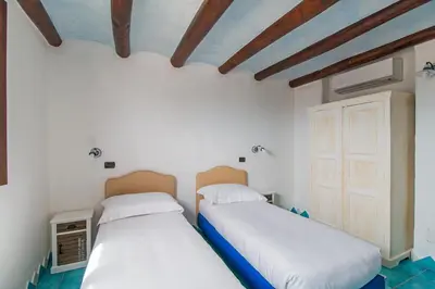 Letto o letti in una camera di Casa La Vela