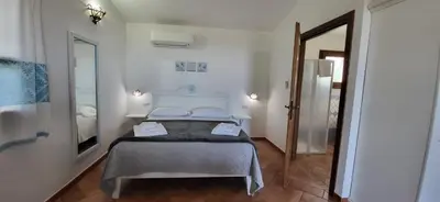 Letto o letti in una camera di Agriturismo Su Barcu