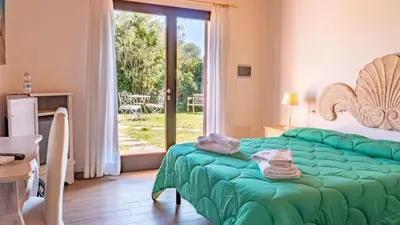 Letto o letti in una camera di QUADRIFOGLIO Affittacamere