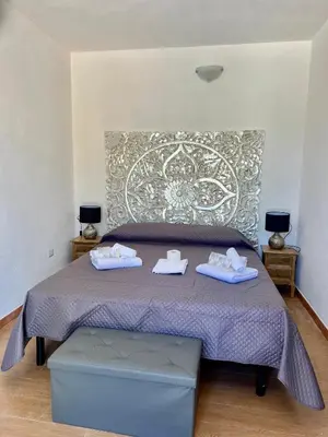 Letto o letti in una camera di QUADRIFOGLIO Affittacamere
