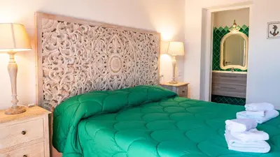 Letto o letti in una camera di QUADRIFOGLIO Affittacamere