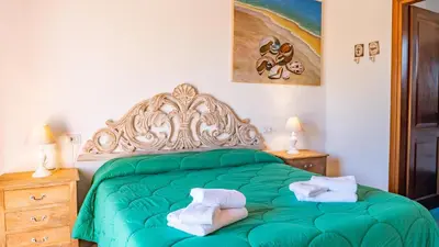 Letto o letti in una camera di QUADRIFOGLIO Affittacamere