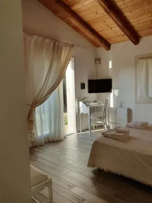 Letto o letti in una camera di Nacchinono