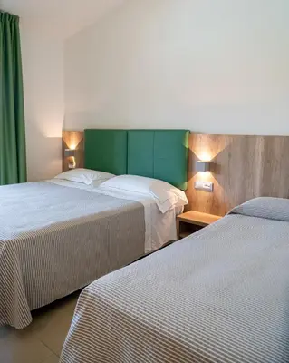 Letto o letti in una camera di Hotel San Teodoro