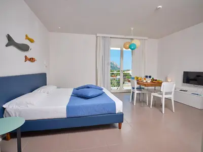 Letto o letti in una camera di Felix Hotels - Hotel Residence Porto San Paolo