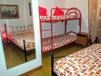 Letto o letti in una camera di Villa Arancio Giorgio