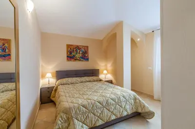 Letto o letti in una camera di Appartamento Mare Sardegna Porto San Paolo