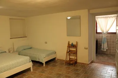Letto o letti in una camera di Casa vacanza Tanaunella