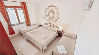 Letto o letti in una camera di Le Sughere