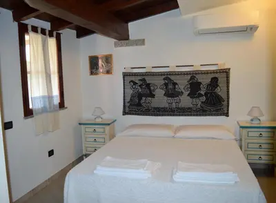 Letto o letti in una camera di B&B Feronia