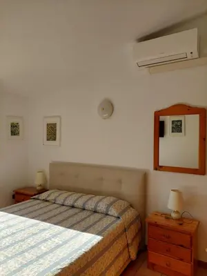 Letto o letti in una camera di Casa Gemma