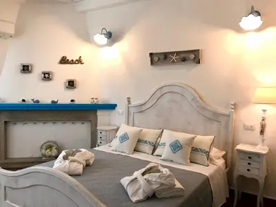 Letto o letti in una camera di PALMASERA CHARMING - Rooms & Suites