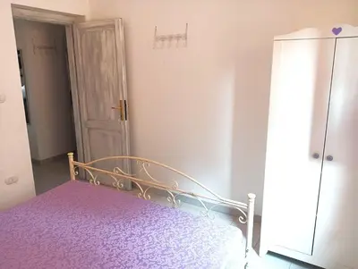 Letto o letti in una camera di BUDONI MARE, Parcheggio e WIFI gratis