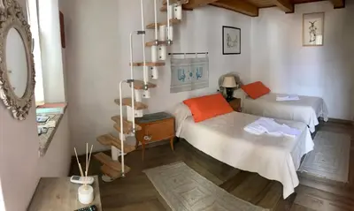 Letto o letti in una camera di B&B Pascal House Nuoro_IUN E5016