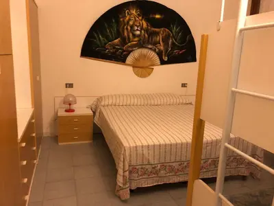 Letto o letti in una camera di Trilocale I Fari