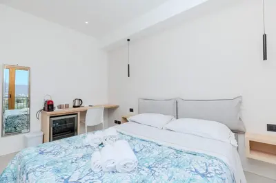 Letto o letti in una camera di Antares Rooms and Suites