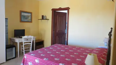Letto o letti in una camera di La Calendula