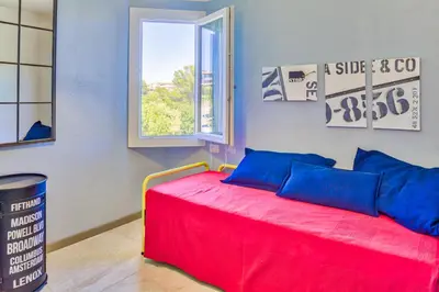Letto o letti in una camera di Appartamenti Ortensia Golfo Aranci
