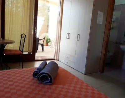 Letto o letti in una camera di Affittacamere Il FIORE