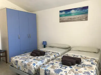 Letto o letti in una camera di Casa Rosa